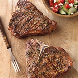 Greek-Seasoned T-Bone Steaks with Cucumber and Tomato Salad