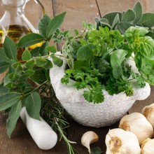 Cooking With Herbs In An Italian Kitchen